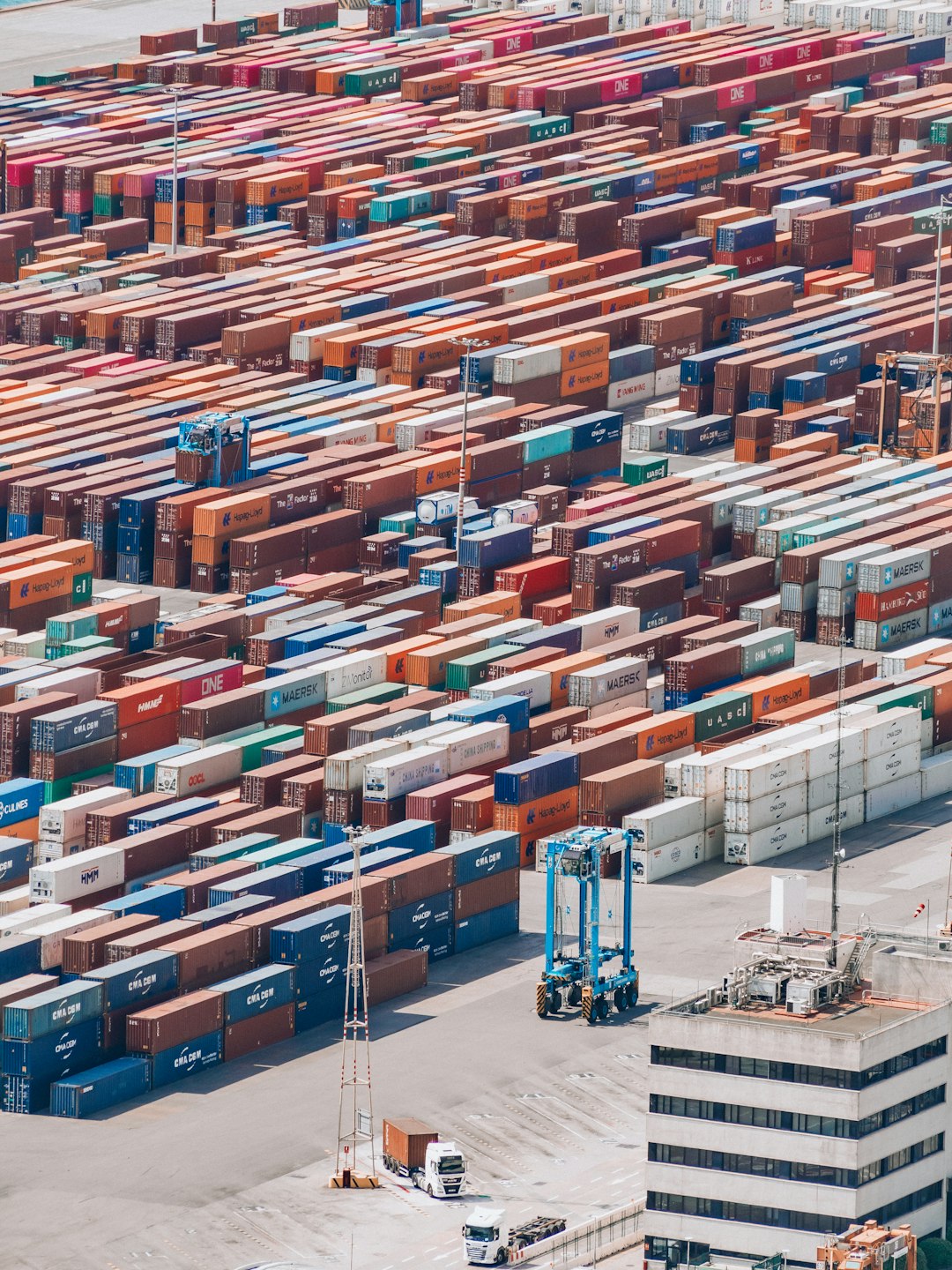 a-large-amount-of-cargo-containers-are-stacked-together-i-dhwk3v9jk