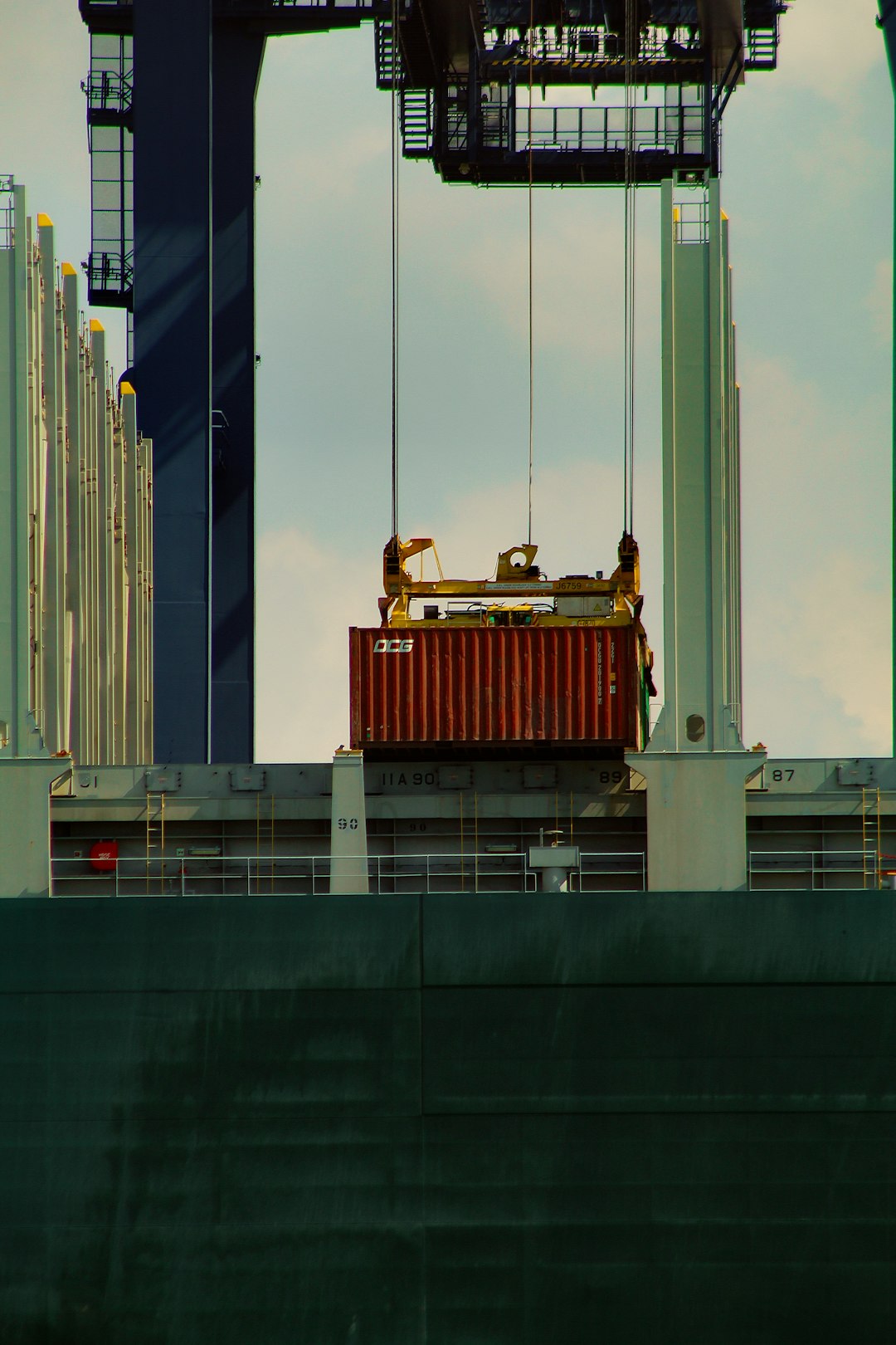 red-and-black-ship-on-body-of-water-during-daytime-5kvija3rh70